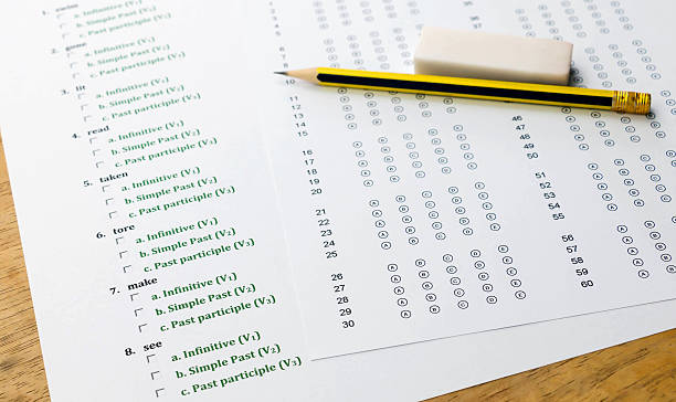 istock english exercise and answer sheet on brown wooden table 542216722