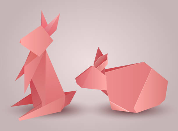 istock Set of origami paper rabbits separately from the background. 542218026