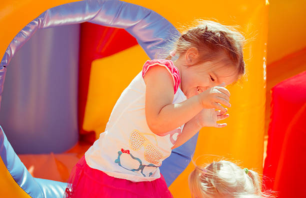 istock child on a colorful trampoline 542285016