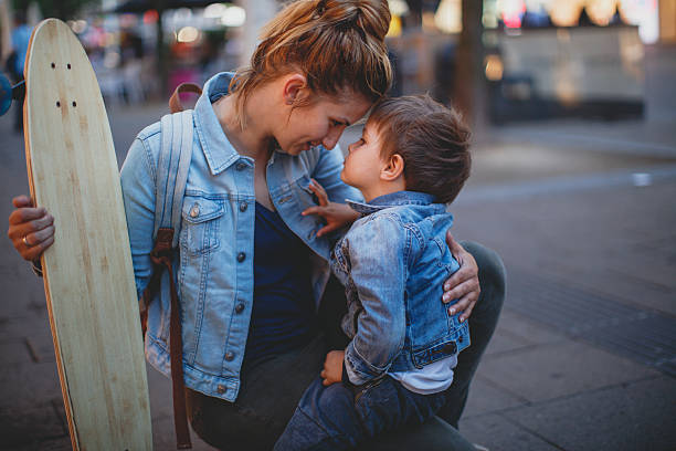 istock Little skater and his mom 542287250