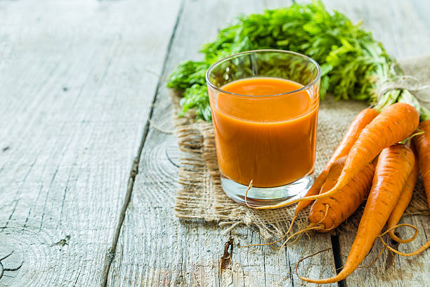 istock Carrot juice in glass 542290412