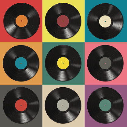 Vinyl records with colorful labels on colorful background.