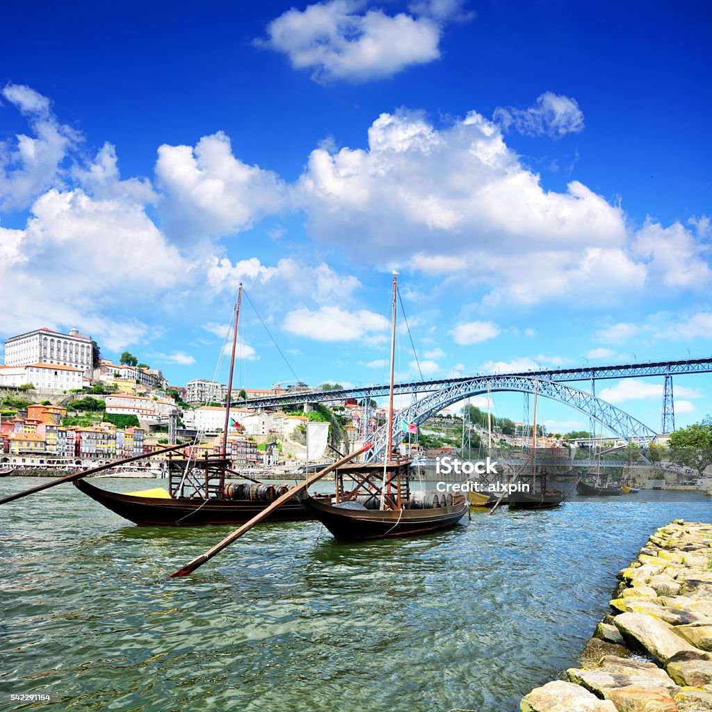 Port Skyline Rabelo boats on the Douro river and Dom Luis I bridge in Porto, Portugal. Composite photo Portugal Stock Photo