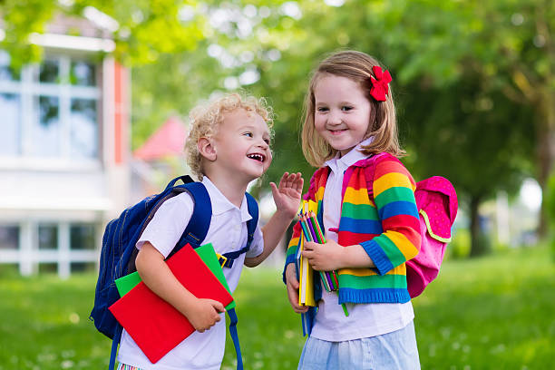 istock Happy kids on first school day 542291476