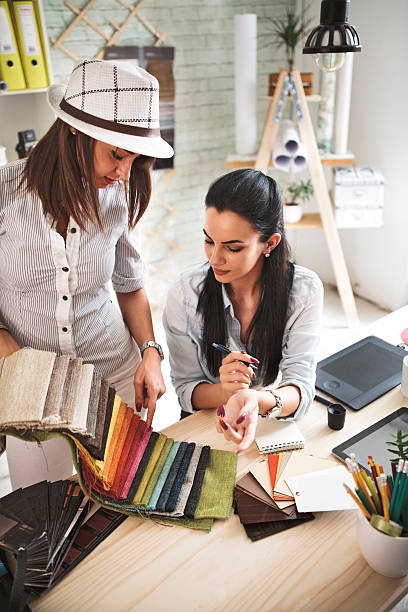 Young female designer in office