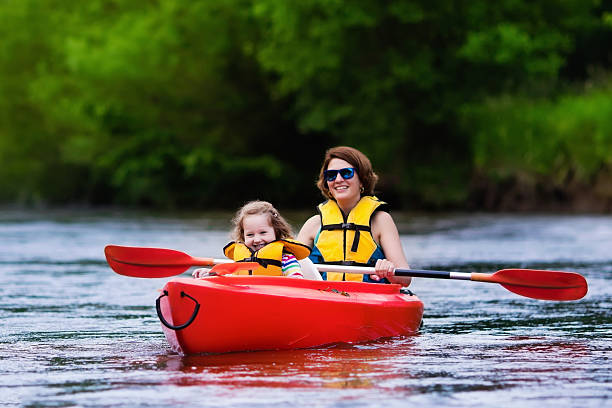 mother and child in a kayak - family kayaking kayak canoeing imagens e fotografias de stock