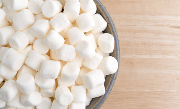 istock Small marshmallows in an old stoneware bowl 542295802