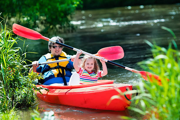 istock Father and child kayaking in summer 542295990