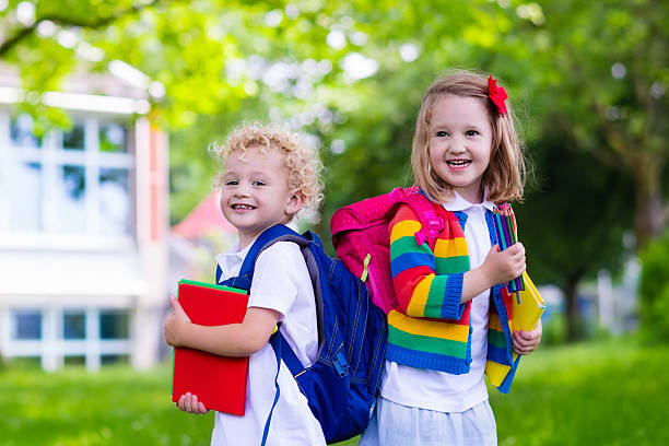 istock Beautiful kids on first school day 542297458