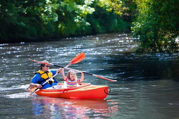 istock Father and child kayaking in summer 542297850
