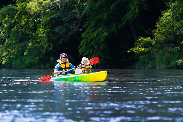 istock Father and child kayaking in summer 542298170
