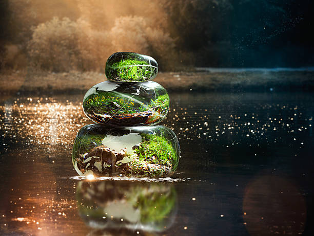 Transparent stones in water Zen pyramid. Stones of the volume inside the stones nature, flowers. Concept - peace of mind, inner peace, harmony, environmentTransparent stones in water Zen pyramid. Stones of the volume inside the stones nature, flowers. Concept - peace of mind, inner peace, harmony, environment