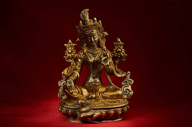 istock Statuette of Green Tara on a red background. 542301022