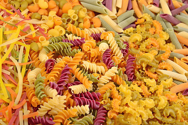 istock Assortment of colored uncooked Italian pasta close up 542301508