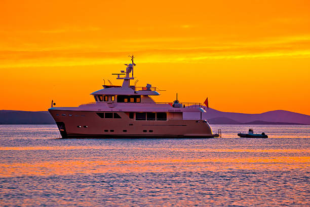 istock Yacht at golden sunset on open sea 542301648