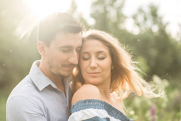 istock loving couple embracing each other in nature 542301796