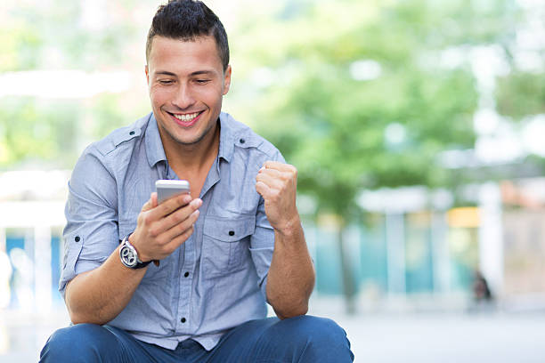 istock Young man with smartphone outdoors 542301844