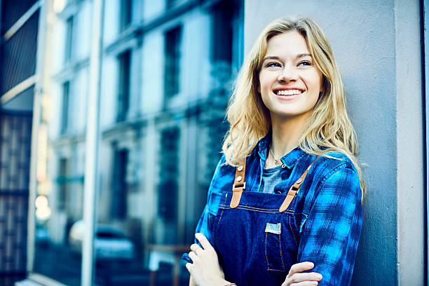 istock Hipster barista standing outside cafe 542302324