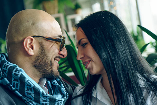 istock Arab man sits, hugs a beautiful girl 542305442