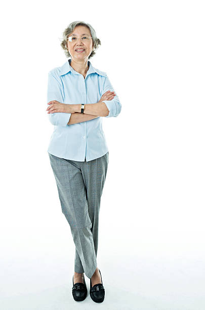 istock Smiling senior businesswoman isolated on white background 542305986