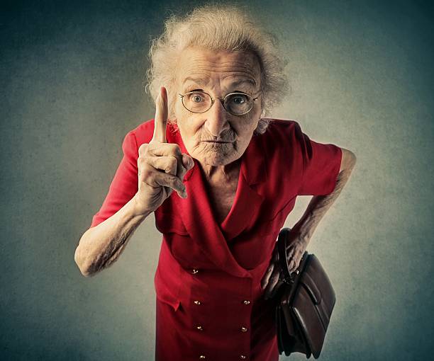 Angry old lady stock photo