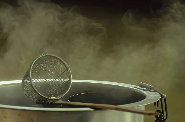 istock Noodle strainer with wood handle and warm aluminum stock pot 542307686