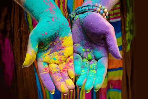 Colorful holi painted hands in different positions