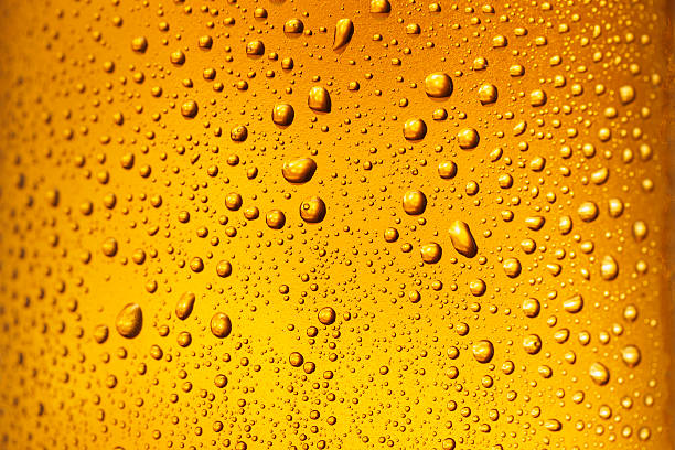 istock Ice Cold  Glass Covered with water drops  condensation Beer Background 542311770