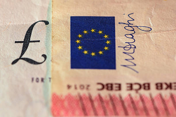 istock Euro bank note against a pounds bank note 542313298
