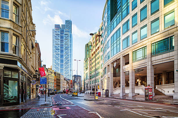 istock Empty wet downtown London Bishopsgate street on a Sunny morning 542314042