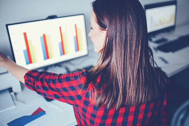 istock Woman at the office,rear view 542316210