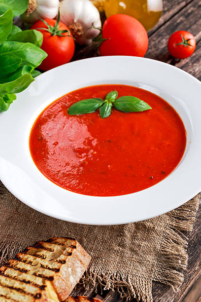 istock Smooth and sweet tomato soup, seasoned with basil, garlic. 542317202