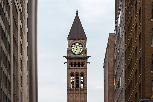 View of the Old City Hall in Toronto framed by the office buildings in Bay Street at dusk.