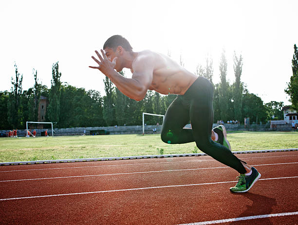 istock man  athlete training on a race track 542320312