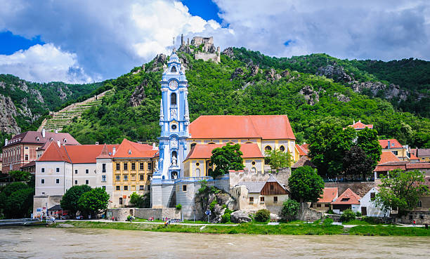 Durnstein Abbey The beautiful blue and white clock tower of the Durnstein Abbey along the Danube River in lower Austria. durnstein stock pictures, royalty-free photos & images