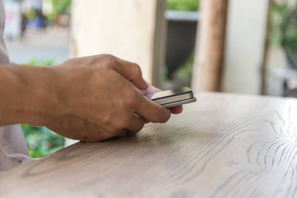 istock Closed up of male hand using smartphone for work 542321366