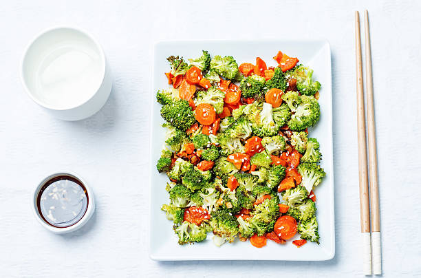 istock Asian roasted carrots and broccoli 542327144