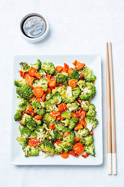 istock Asian roasted carrots and broccoli 542327146