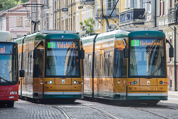 Norrkoping, Sweden - June 19, 2016: The iconic yellow trams in Norrkoping. Norrkoping is a historic industrial town in Sweden.