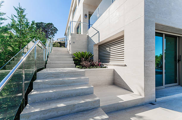 istock Luxury modern house with swimming pool with waterfall jet. House 542327692