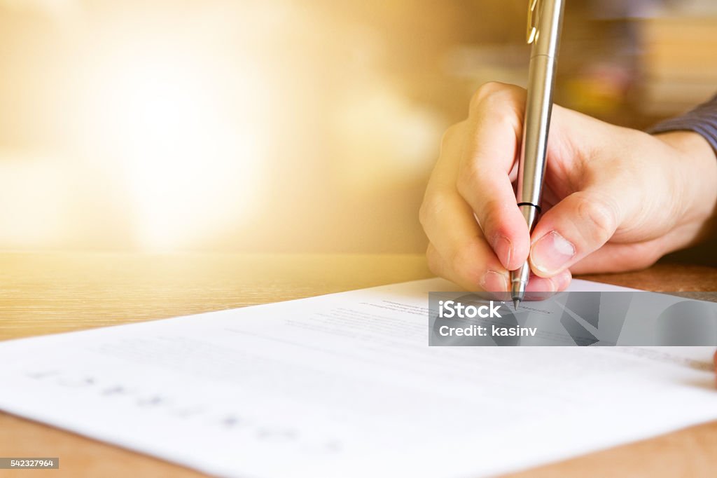 business man signing contract document business man signing contract document on office desk Signing Stock Photo
