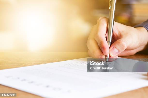 Business Man Signing Contract Document Stock Photo - Download Image Now - Signing, Application Form, Sign