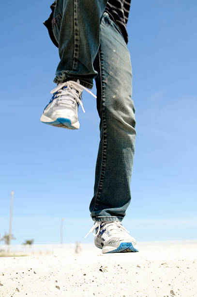 Jumping boy at beach - fotografia de stock