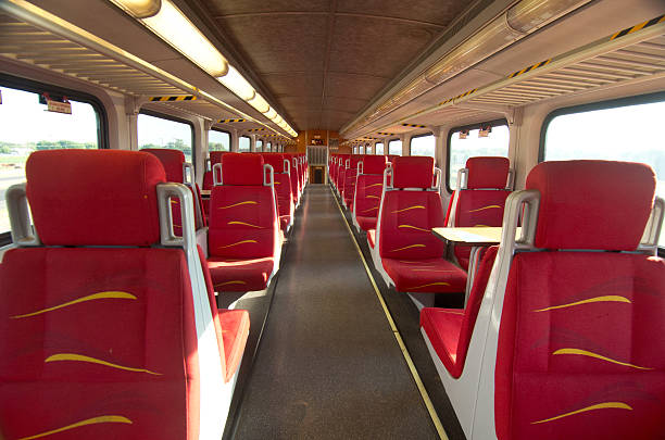 istock Commuter Train, Red, Tan Passenger Car Interior, Transport Service 542329606