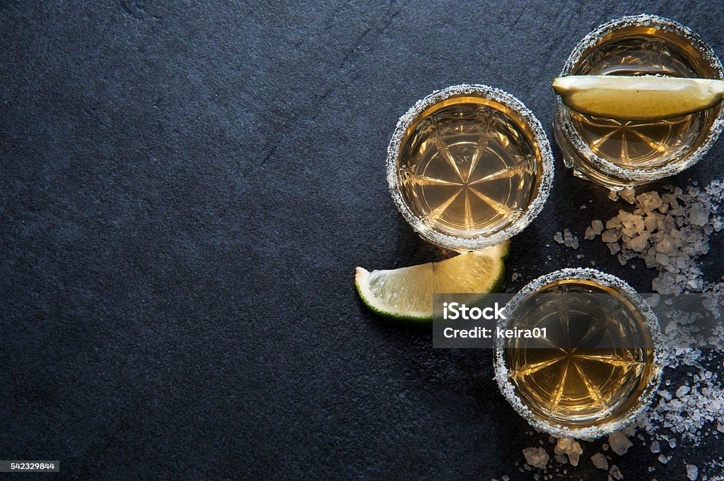 Tequila shots with lime slice, top view Tequila shots with lime sliceand salt, top view Tequila - Drink Stock Photo