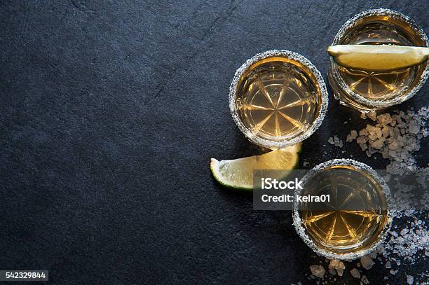 Tequila Shots With Lime Slice Top View Stock Photo - Download Image Now - Tequila - Drink, Backgrounds, Drink