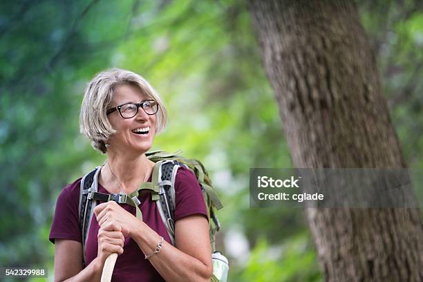 Happy Senior Woman Backpacking Stock Photo - Download Image Now - Hiking, Women, Eyeglasses