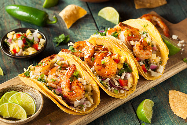 Homemade Spicy Shrimp Tacos Homemade Spicy Shrimp Tacos with Coleslaw and Salsa mexico stock pictures, royalty-free photos & images