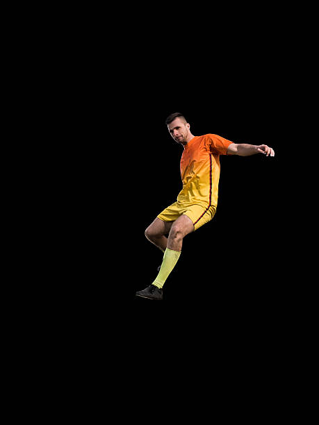 istock Professional football player in red uniform on training 542332262