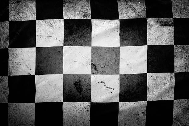 Checkered flag Grungy checkered black and white racing flag auto racing photos stock pictures, royalty-free photos & images